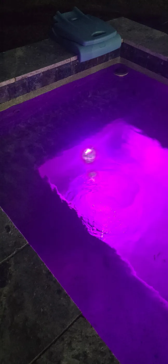Pool and spa with color LED lighting and smart automation installed by Redzone Pools in Greater Houston